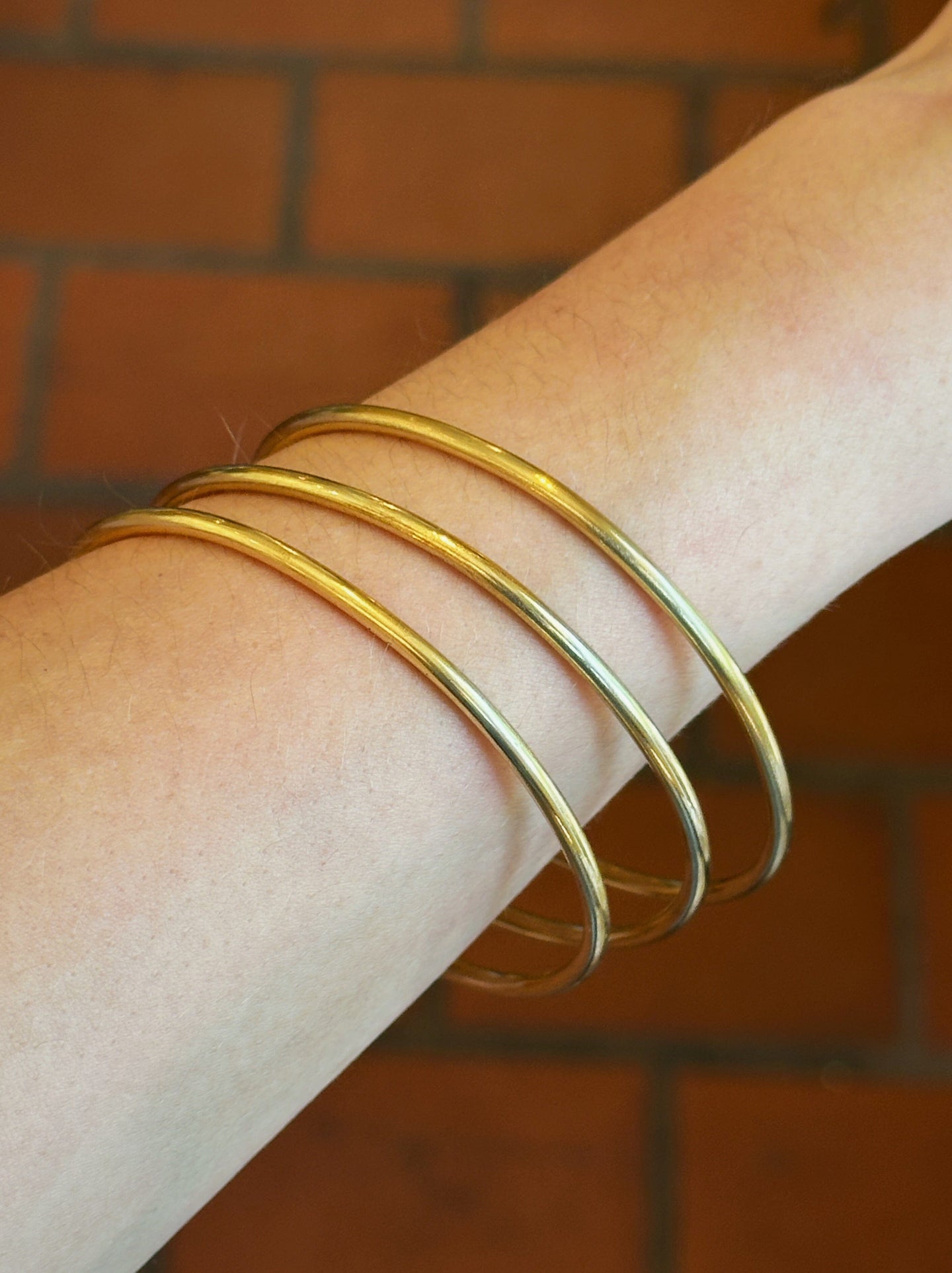 Brass Bangles Fossil and Hide 